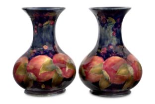 William Moorcroft (1872-1945)  Pair of vases in pomegranate pattern, 1916-1918  Glazed earthenwa...