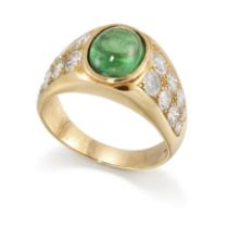 An emerald and diamond ring, the single cabochon emerald in collet mount with diamond eight stone...