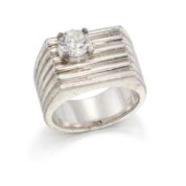 A diamond set panel ring, the rectangular reeded head claw set to one corner with a brilliant-cut...
