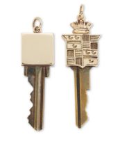 Two gold mounted keys, one with Cadillac logo design finial, engraved verso 'to my beauty, for he...