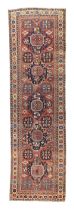 A Caucasian Kazak long rug, first quarter 20th century, the central field with five geometric med...