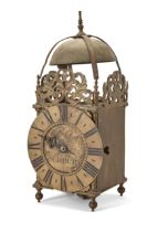 A brass lantern clock, late 18th century and later, the bell above three pierced frets and slende...