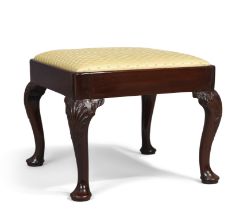 A George II mahogany stool, third quarter 18th century, yellow silk upholstered drop in seat, on ...