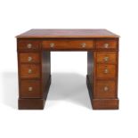 A Regency mahogany partners desk, of small proportions, first quarter 19th century, the tooled re...