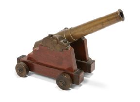 An English mahogany and brass table cannon, second half 19th century, modelled as a garrison cann...