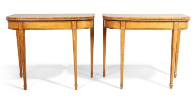 A pair of George III ebony and line inlaid satinwood card tables, last quarter 18th century, the ...