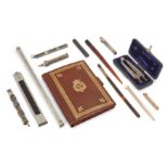 A collection of architectural and writing instruments, comprising: a French silver and ebony moun...