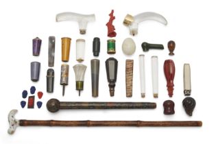 A collection of hardstone and enamel parasol handles, 19th and early 20th century, including: som...