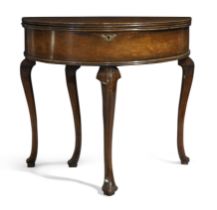 A George II mahogany demi-lune tea table, second quarter 18th century, the hinged fold over top r...