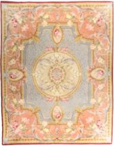 A large woollen carpet with Aubusson design, first quarter 20th century, the floral design on a p...