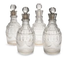 Two similar pairs of George III lead crystal decanters and stoppers, late 18th / early 19th centu...