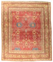 An Indian Agra carpet, last quarter 19th century, the central field with stylised geometric flora...