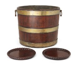 A George III mahogany and brass bound wine cooler or peat bucket, with twin handles, 29.5cm high,...