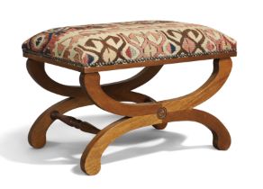 An English mahogany X-frame stool, of Regency style, 20th century, with kilim upholstered seat, 4...