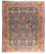 A Turkish carpet, second quarter 20th century, the central field with geometric floral motifs, on...