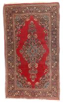 A Persian Kashan rug, first quarter 20th century, the central field with floral medallion, on a r...
