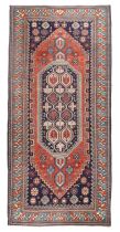 A Caucasian Shirvan rug retailed by Waring & Gillow, first quarter 20th century, the central fiel...