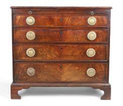 A George III mahogany chest, first quarter 19th century, the rosewood crossbanded top above brush...