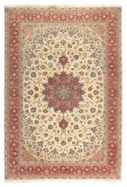 A Persian Tabriz carpet, last quarter 20th century, the central floral medallion surrounded by fl...