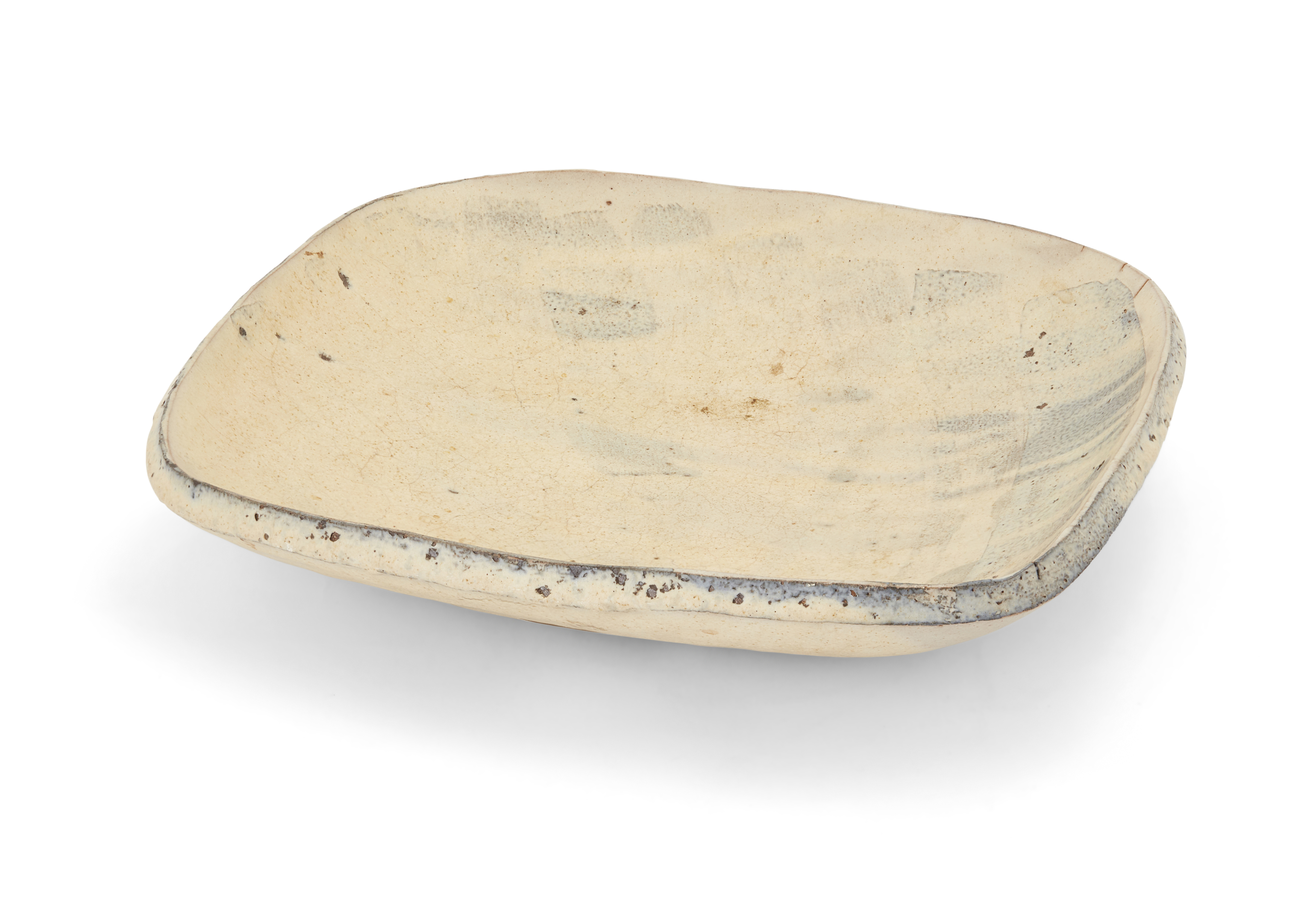 A studio pottery baking dish, second half 20th century, of rounded rectangular form, with blue sl...