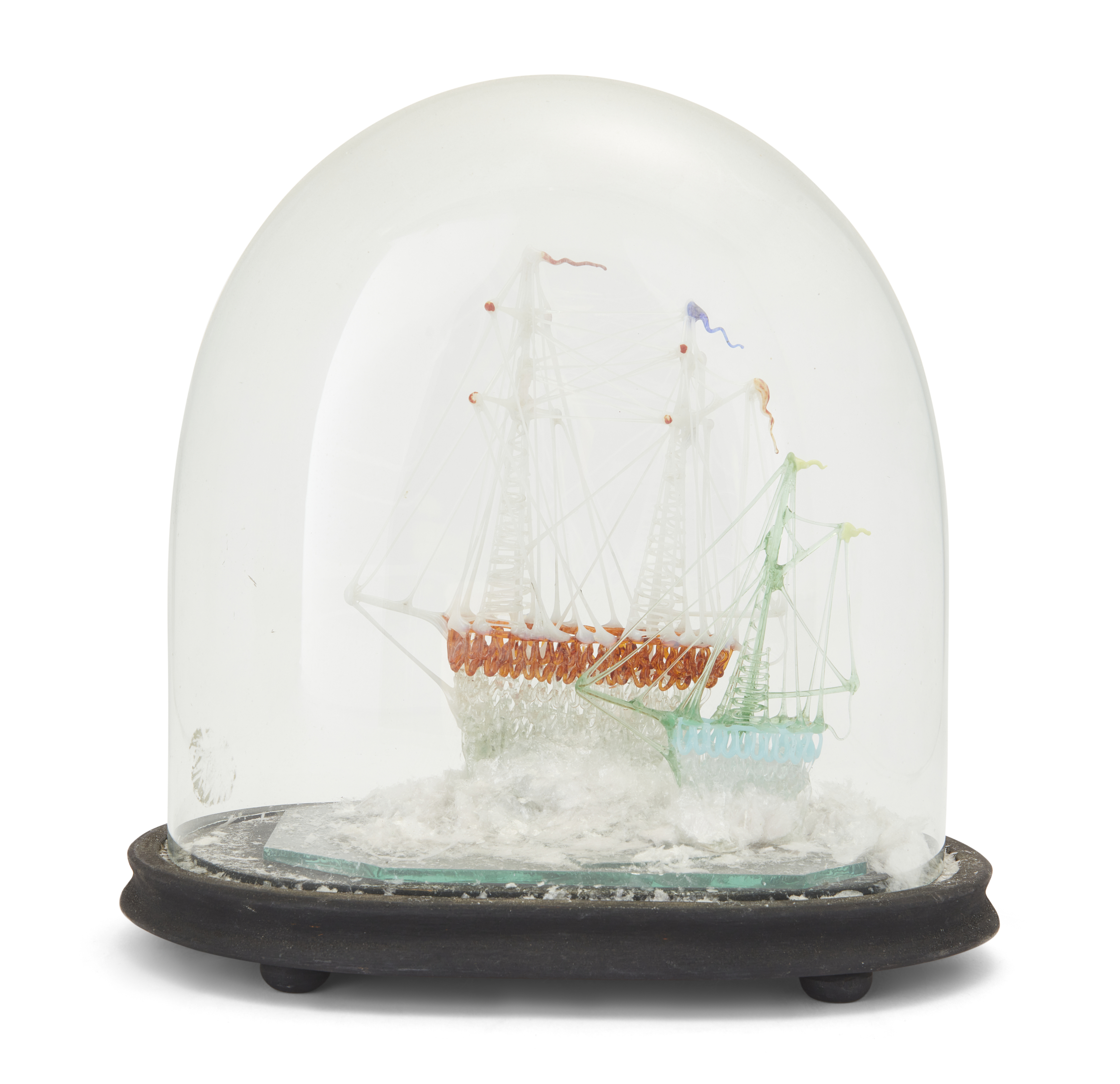 A Victorian Nailsea type coloured glass model of two friggers, under a glass dome with later stai...
