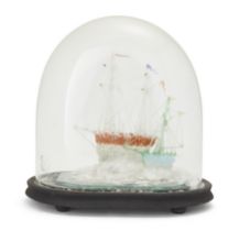 A Victorian Nailsea type coloured glass model of two friggers, under a glass dome with later stai...