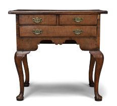 A George II walnut lowboy, second quarter 18th century, crossbanded and line inlaid, the rectangu...