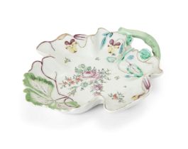 A Longton Hall 'Strawberry Leaf' dish, c.1755, modelled as a single leaf with a green branch hand...