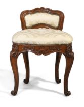 A Louis XV elm musicians stool, last quarter 18th century, with silk damask upholstery, on cabrio...
