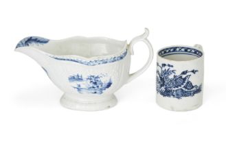 A Worcester blue and white porcelain sauce boat, c.1760-65, blue crescent mark, moulded with fine...