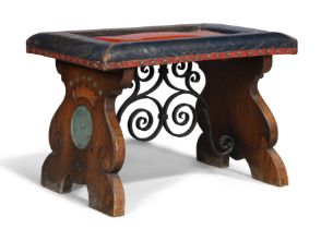 An Arts and Crafts oak and polychrome stool, last quarter 19th century, with red and blue leather...