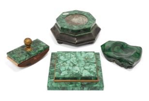 A group of four malachite desk ornaments, late 19th century, comprising: a blotter with gilt-bras...