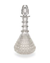 A large cut-glass decanter and stopper, early 19th century, of bell shape with triple-ringed neck...