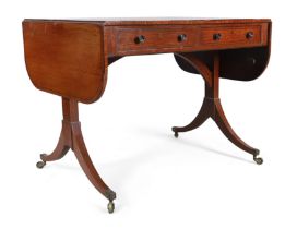 A George III ebony inlaid mahogany sofa table, last quarter 18th century, the drop leaf top above...