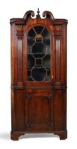 A George II inlaid walnut architectural floor standing corner cupboard, second quarter 18th centu...