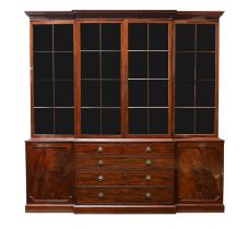 A George III mahogany library bookcase, last quarter 18th century, the stepped cornice with rosew...