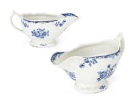 A pair of Lowestoft blue and white porcelain sauce boats, c.1770, blue crescent marks, each mould...