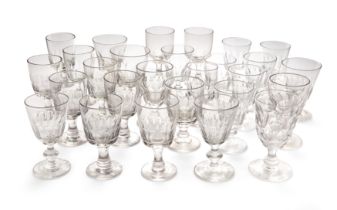 A large group of George III cut and faceted wine and water glasses, late 18th / early 19th centur...