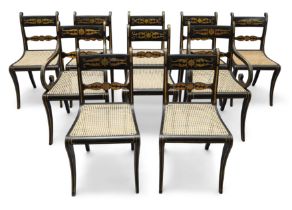 A set of ten Regency painted and ebonised dining chairs, first quarter 19th century, to include t...