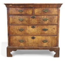 A George II walnut chest, second quarter 18th century, feather banded, the crossbanded top above ...