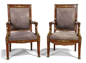 A pair of Empire gilt-brass mounted mahogany armchairs, first quarter 19th century, grey suede up...