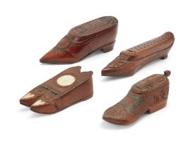 A group of four chip-carved treen shoe snuff boxes, probably Dutch, early 19th century, three wit...