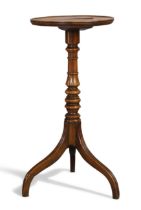 A George III fruitwood tripod table, last quarter 18th century, the circular top above turned col...