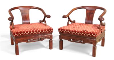 A pair of Chinese style hardwood armchairs by Saridis, Greek, 20th century, with horseshoe backs ...