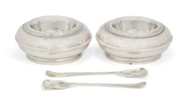 A pair of Queen Anne silver salt cellars.  James Goodwin,  London, 1713.  Of circular form wit...