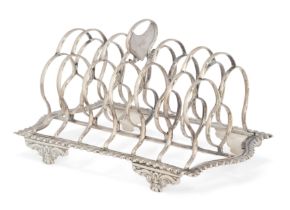 A Georgian silver six division toast rack.  Crispin Fuller,  London, 1820.  The seven bars to ...