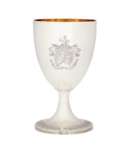 A George III silver goblet.  Henry Chawner,  London, 1789.  The tapering bowl raised on a chas...