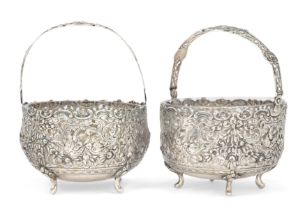 A pair of German silver sugar bowls.  Stamped 800.  The circular bodies with clear glass liners...