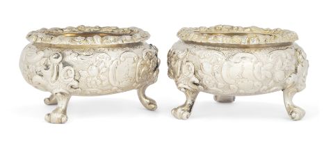 A pair of Regency parcel gilt silver salt cellars.  Charles Price,  London, 1819.  The cast bo...