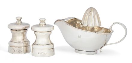 A silver citrus juicer.  Cartier,  Stamped 925, Italy.  The boat-shaped body with straining se...